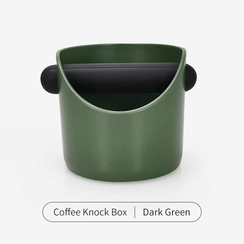 A dark green coffee knock box with a black lid.