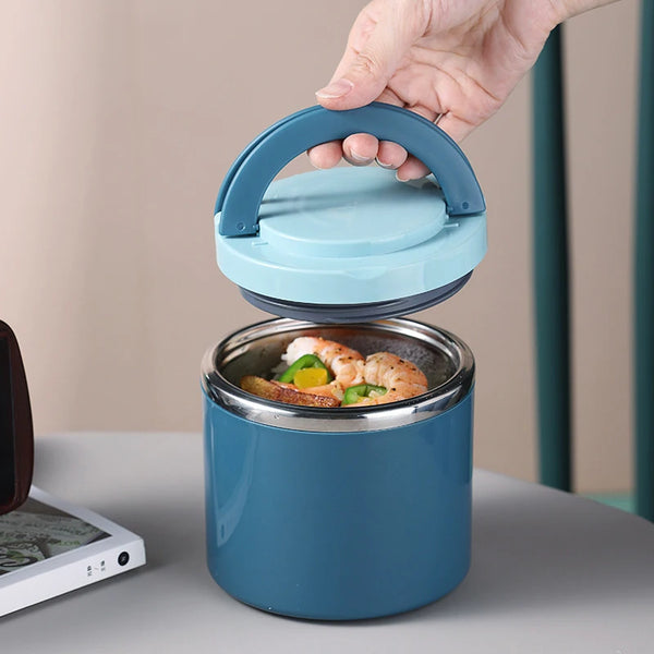 A hand is lifting the lid of a blue stainless steel insulated food jar containing cooked shrimp.