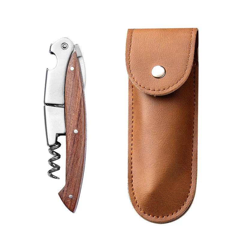 A double-hinged waiter's corkscrew with a foil cutter, featuring a brown leather handle and silver metal components.