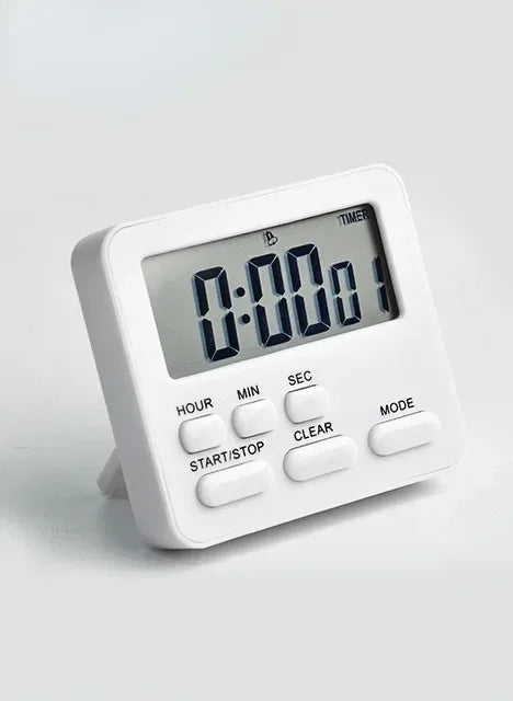 A white digital kitchen timer with a display showing 0:00:01 and various function buttons.