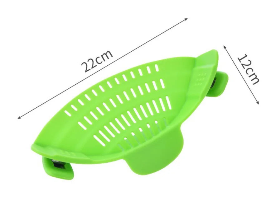 A bright green silicone clip-on strainer with measurements indicating its size.