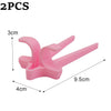Two pink silicone finger guard chopsticks used for snacks and gaming