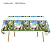 A white tablecloth featuring a tropical dinosaur pattern for a table setting.