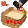 Eine Box mit 500 Backpapier-Linern für die Airfryer und eine Glas-Sprühflasche.