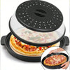 A black silicone splatter guard with a clear lid is shown over a pizza being cooked in an oven dish.