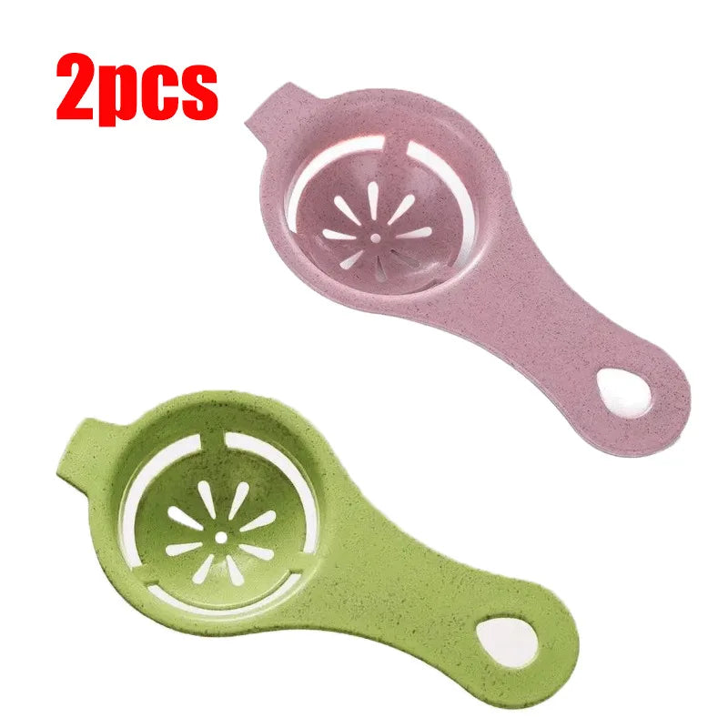 A set of two silicone egg white and yolk separators, one pink and one light green.