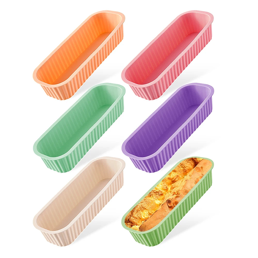 A set of five silicone mini loaf baking pans in various pastel colors including orange, pink, green, purple, and beige.