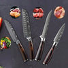 A set of four Damascus steel Japanese kitchen knives with wooden handles displayed on a dark surface.