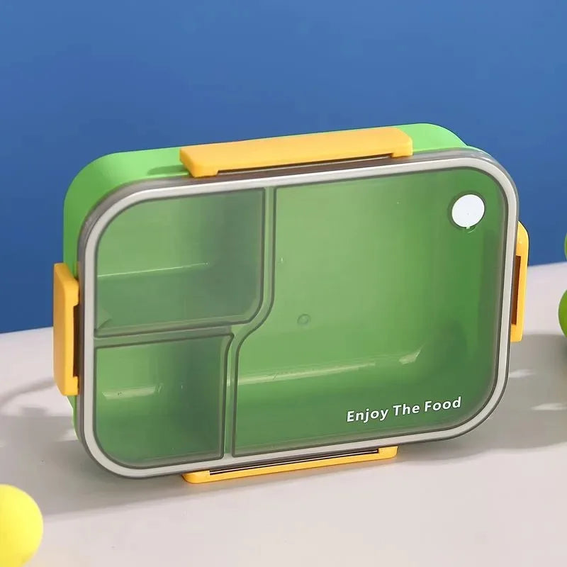 A green and yellow 3-compartment leakproof bento lunch box is shown on a white surface.