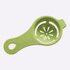 A light green silicone multi-piece egg white and yolk separator set with a perforated bowl.