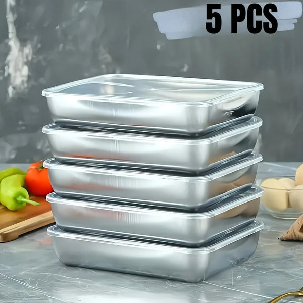 Five stackable stainless steel food storage containers arranged on a gray surface.