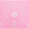 A pink silicone rolling mat with concentric circles marked in centimeters for measuring.