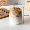A tall glass tumbler filled with iced coffee or latte, showing layers of milk and coffee, next to a size measurement label.
