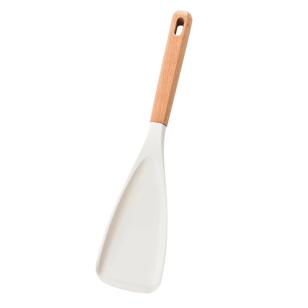 A white silicone cooking spoon and spatula with a light wooden handle.