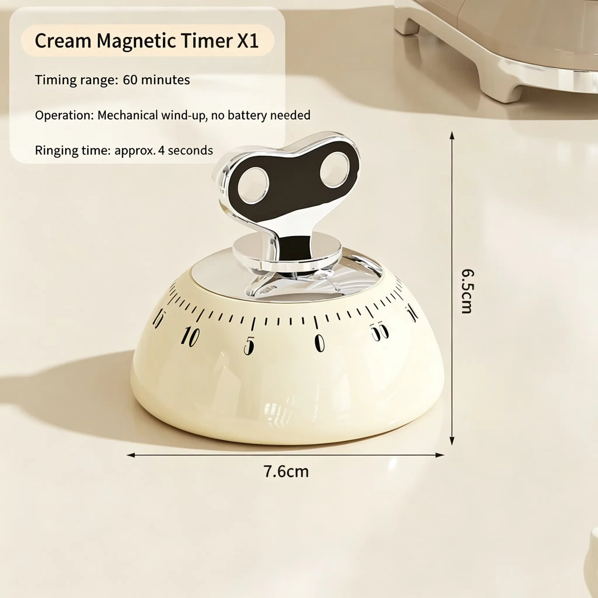 A white magnetic kitchen timer with a rotating dial and a ring for timing, shown on a light surface.