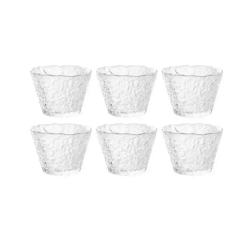 A set of four textured glass tea cups or bowls for a Chinese and Japanese ceremony.