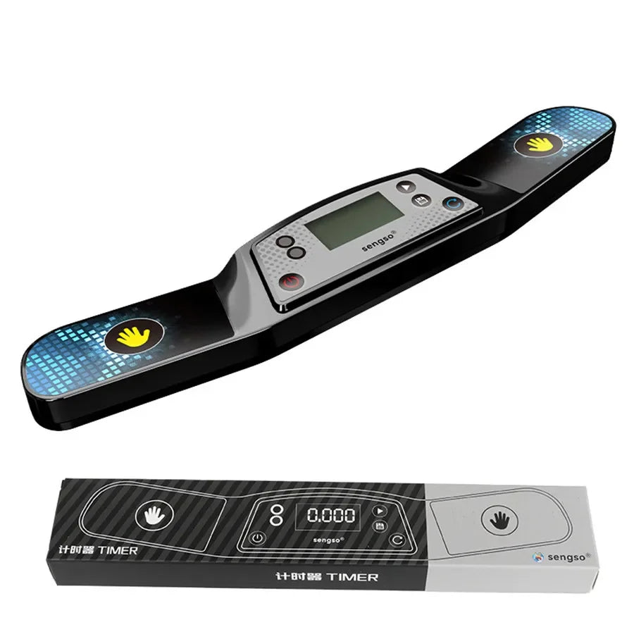 A black electronic timer device with a digital display and yellow buttons is shown on a white background.