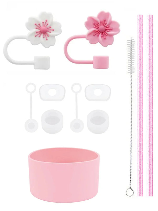 Set wiederverwendbare Silikonstrohhalm-Cover und Reinigungsbürsten in rosa und weiß.