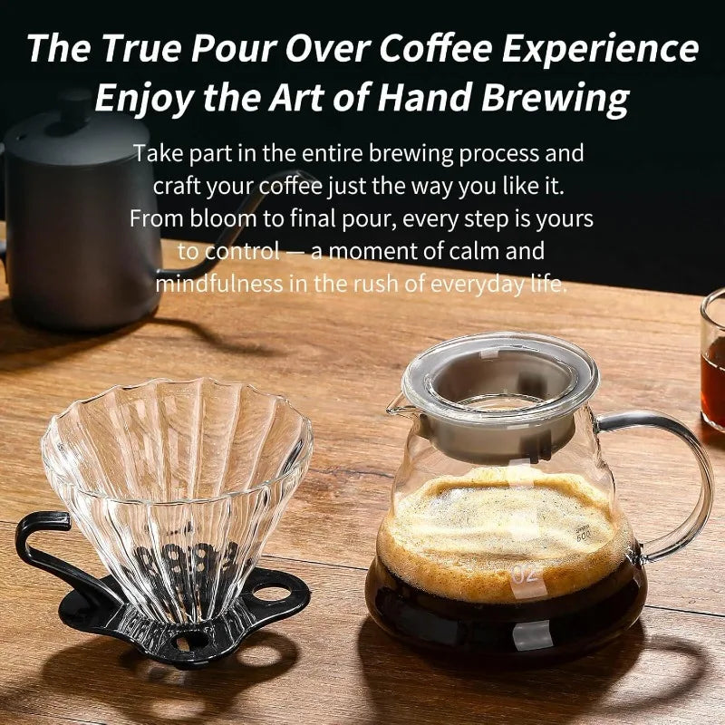 A glass pour over coffee dripper filled with dark coffee is shown on a wooden surface.