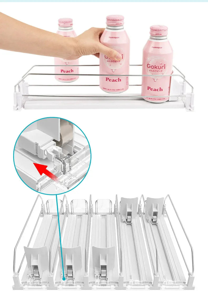 A clear adjustable spring can dispenser rack holding pink and white liquid bottles for kitchen or fridge storage.