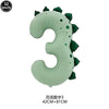A light green inflatable dinosaur shaped like the number three for party decoration