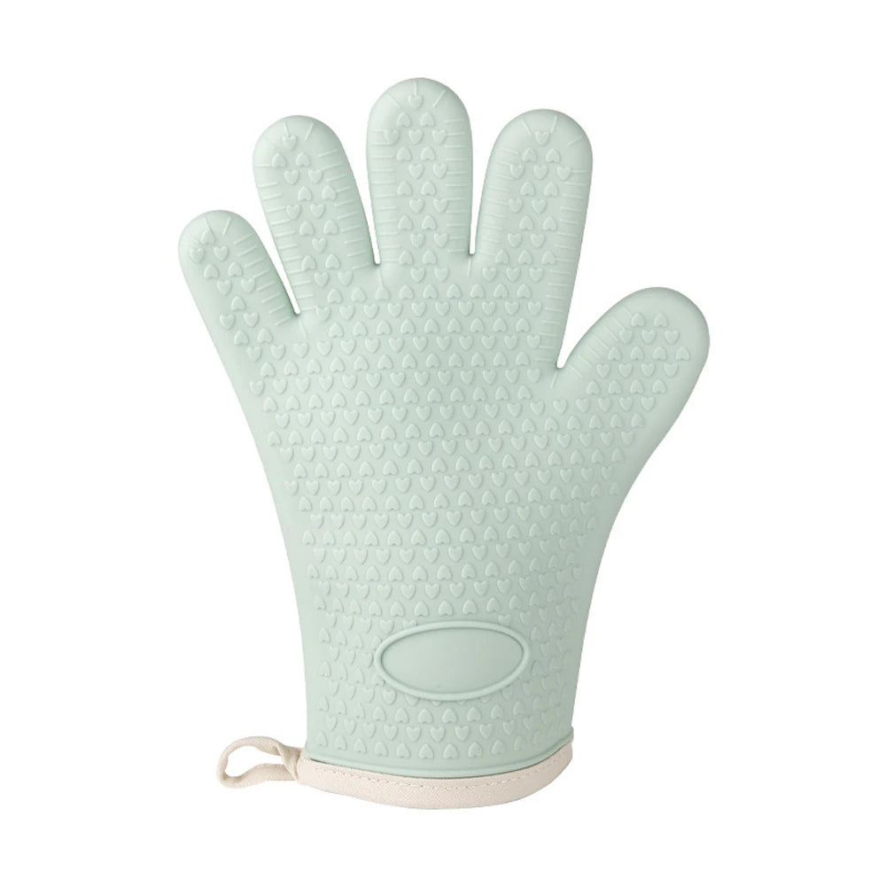Light mint green silicone oven gloves with textured fingertips and a smooth wrist strap.