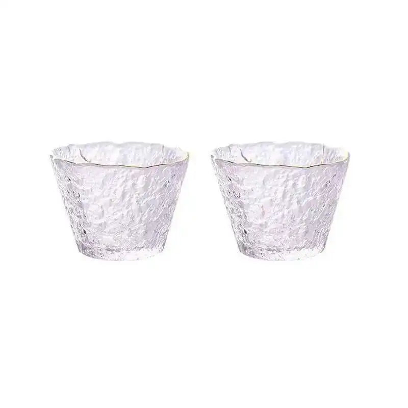 A pair of elegant clear glass tea cups or bowls used for Chinese and Japanese ceremonies.