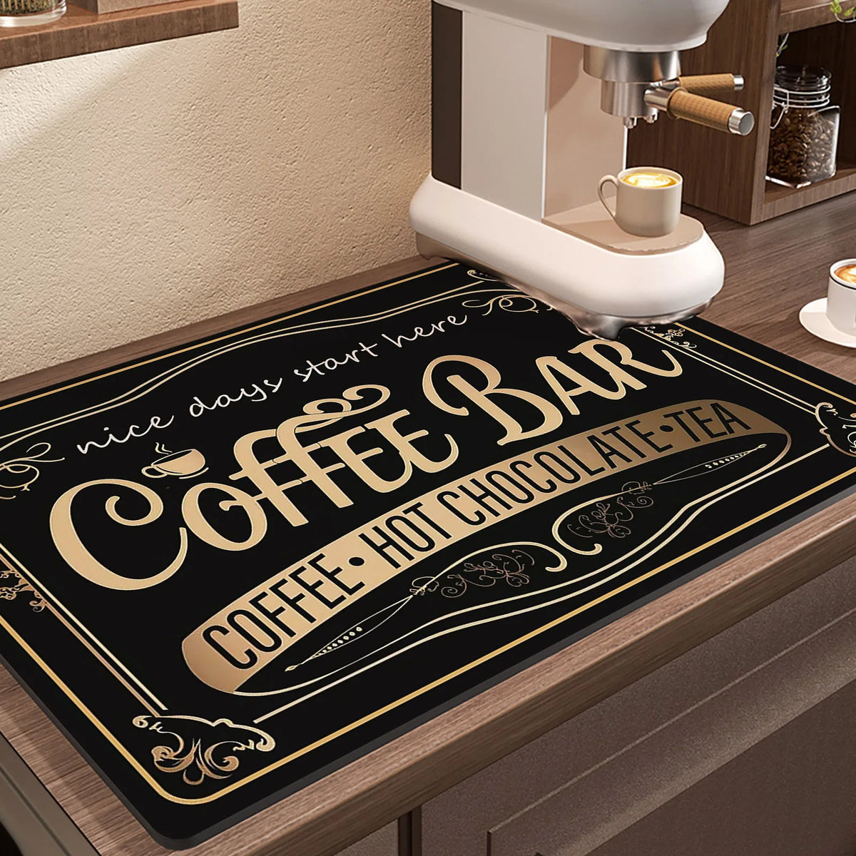 A black mat with gold lettering for a coffee bar featuring the text Nice days start here Coffee Bar Coffee Hot Chocolate Tea
