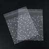 Transparent candy cookie bags with silver dots, shown in a diagonal arrangement.