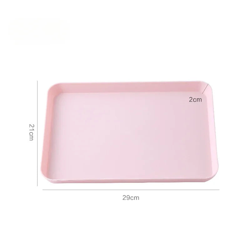 A rectangular pink plastic serving tray with dimensions 29cm by 21cm and a height of 2cm.