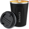A black double-walled stainless steel travel mug filled with latte art, shown next to its lid.