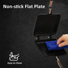 A black non-stick flat plate pan is shown being cleaned with a blue cloth.