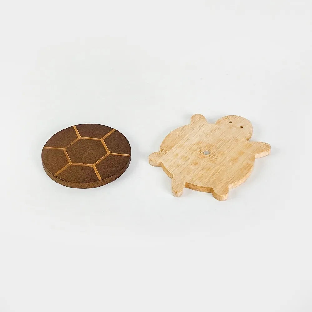 A set of solid wood turtle shaped insulation mats or coasters.