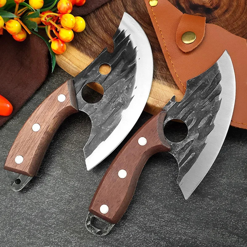A hand-forged stainless steel meat cutting knife with a wooden handle and leather sheath resting on a dark surface.