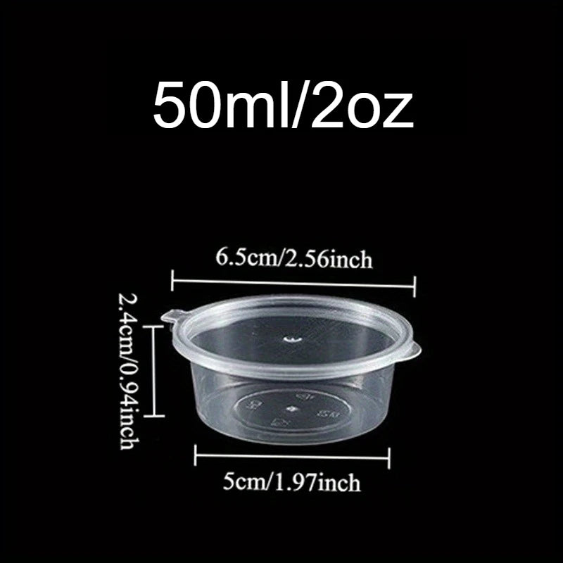 A clear plastic disposable sauce cup with a 50ml/2oz capacity and dimensions of 6.5cm/2.56inch in diameter and 2.4cm/0.94inch