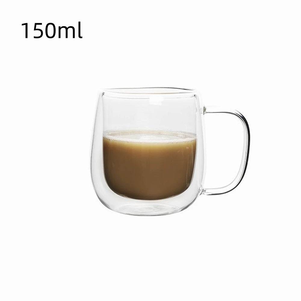 A clear double wall insulated glass coffee cup filled with light brown liquid.