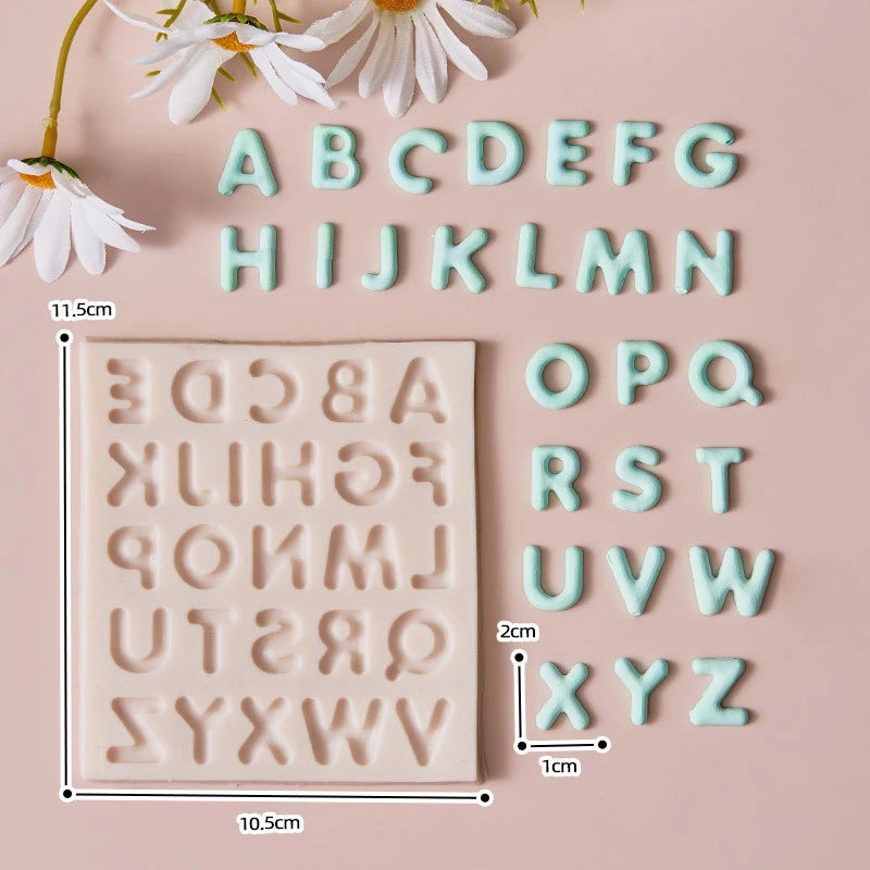 A set of silicone alphabet cake decoration molds in light pastel pink for letters A through Z
