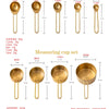Stainless steel measuring spoon and cup set with various sizes and markings