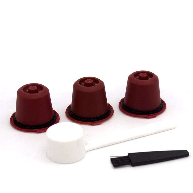 A set of reusable coffee filters for Nespresso capsules in dark red and white.