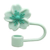 A light mint green flower straw cap for tumblers with a flexible straw attachment.