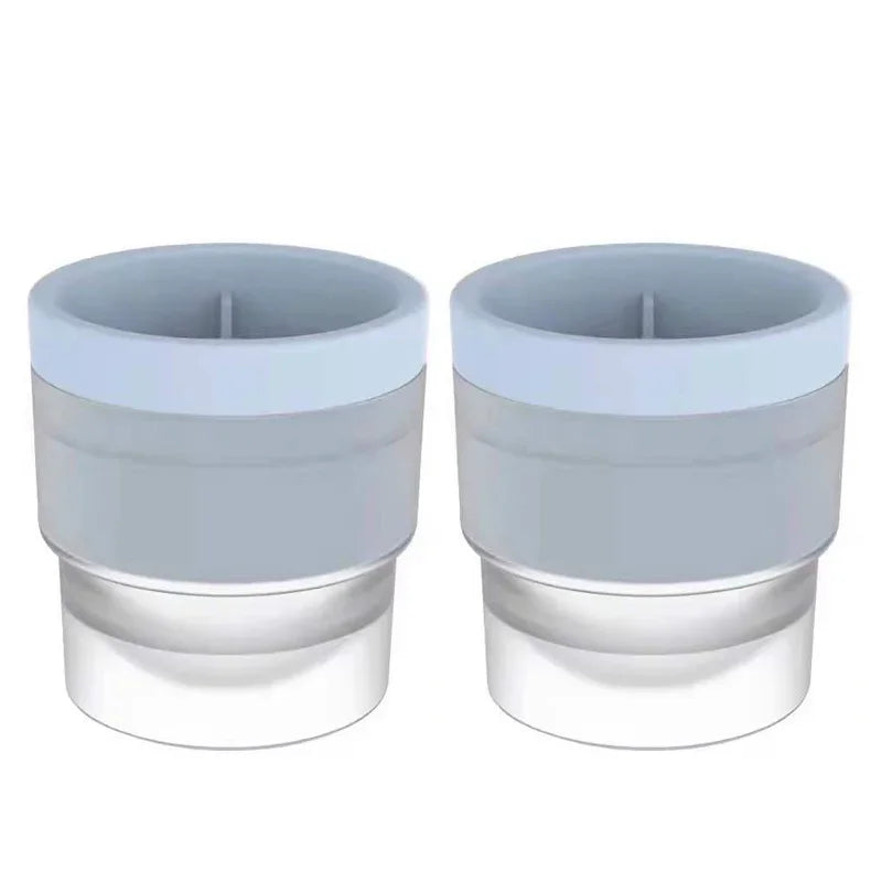 A pair of stackable food-grade ice molds for cocktails, shown in light gray and clear plastic.
