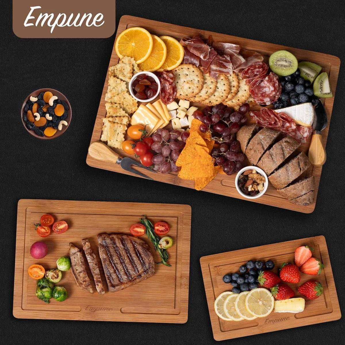 A wooden platter featuring cured meats cheeses olives and fruit arranged for serving