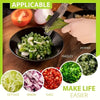 A hand is using triple-blade stainless steel herb scissors to chop fresh ingredients like lettuce, onion, chili, and parsley.