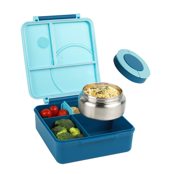 A blue insulated bento lunch box with a clear lid, holding a stainless steel bowl and compartments for food.