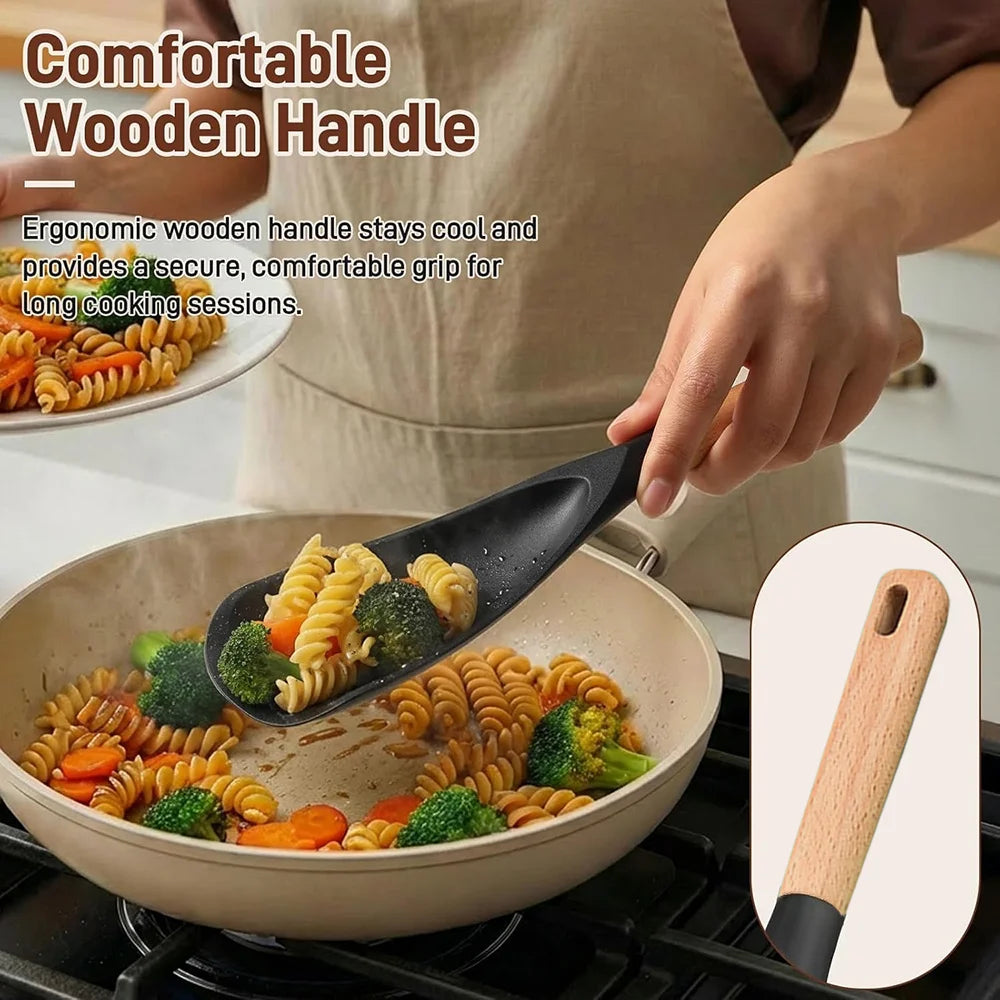 A hand holds a silicone cooking spoon and spatula with a wooden handle, used for cooking.