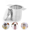 Stainless steel coffee filter funnel with lid shown in various angles and with coffee grounds.