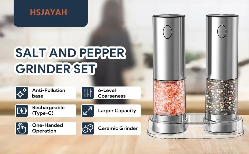 A set of silver salt and pepper grinders with ceramic grinding heads displayed on a wooden surface.