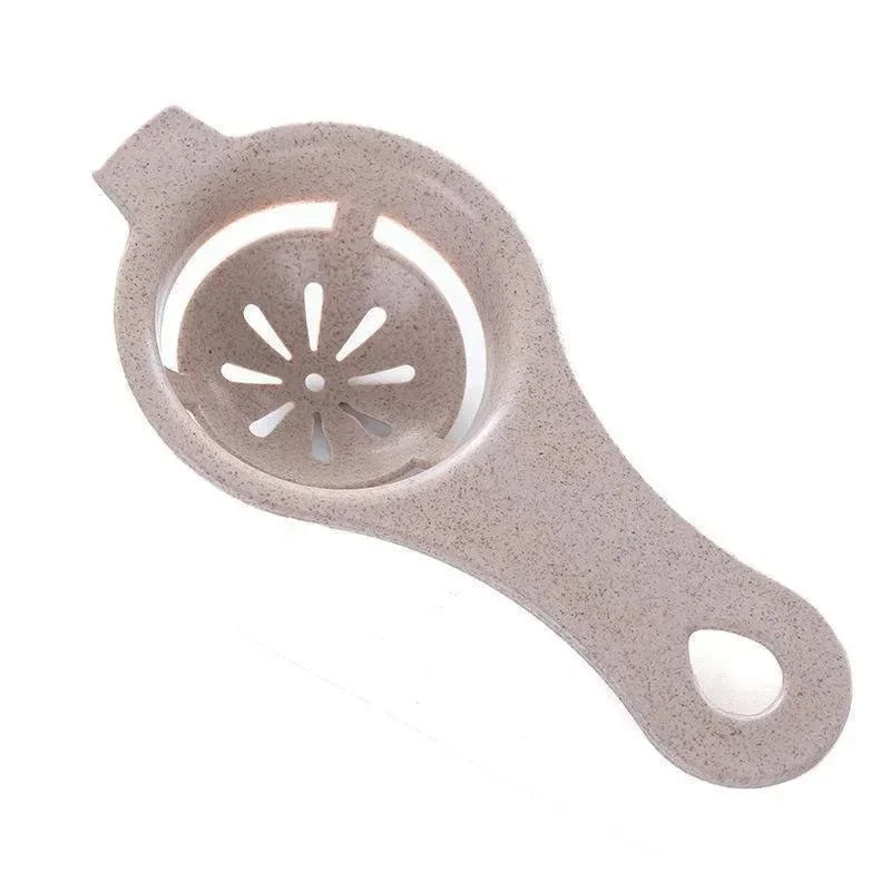 A light beige silicone multi-piece egg white and yolk separator set with a perforated mold.