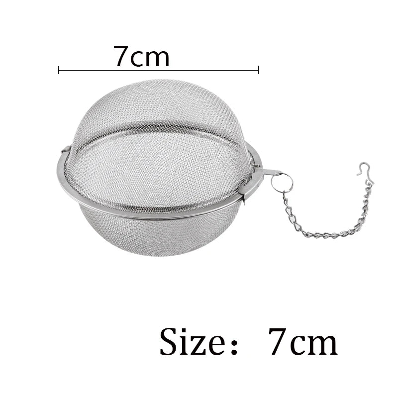 Silver stainless steel tea infuser sphere with a chain for hanging, measuring 7cm in diameter.