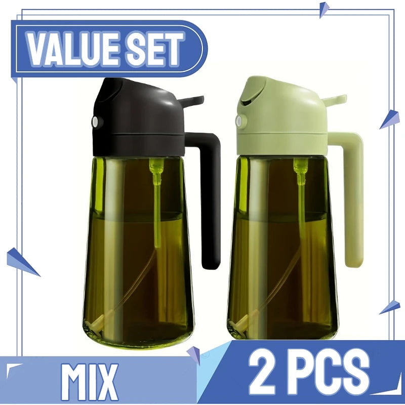 A set of two glass oil spray dispensers, one black and one light green, shown against a white background.